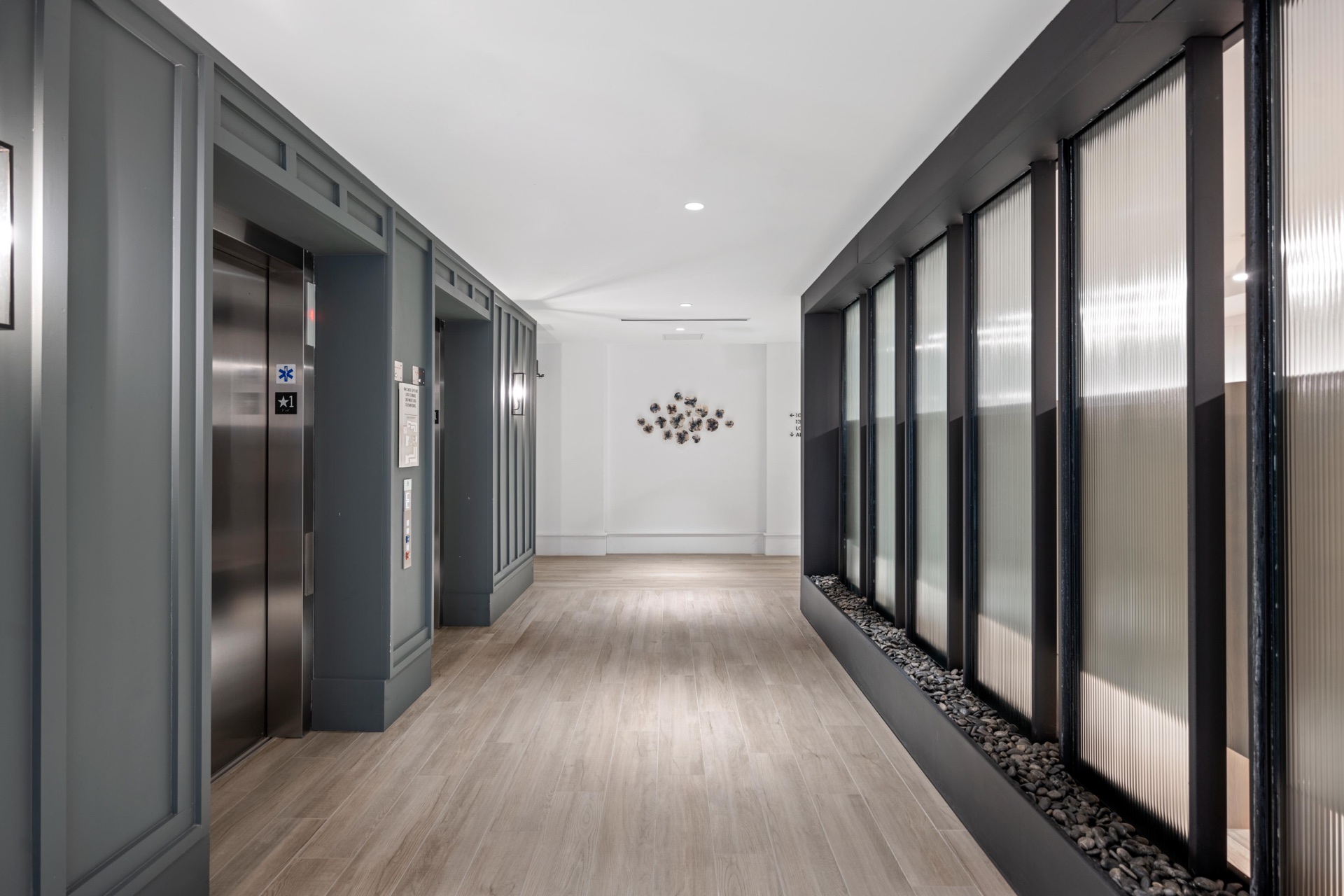 Sleek modern lobby elevators.