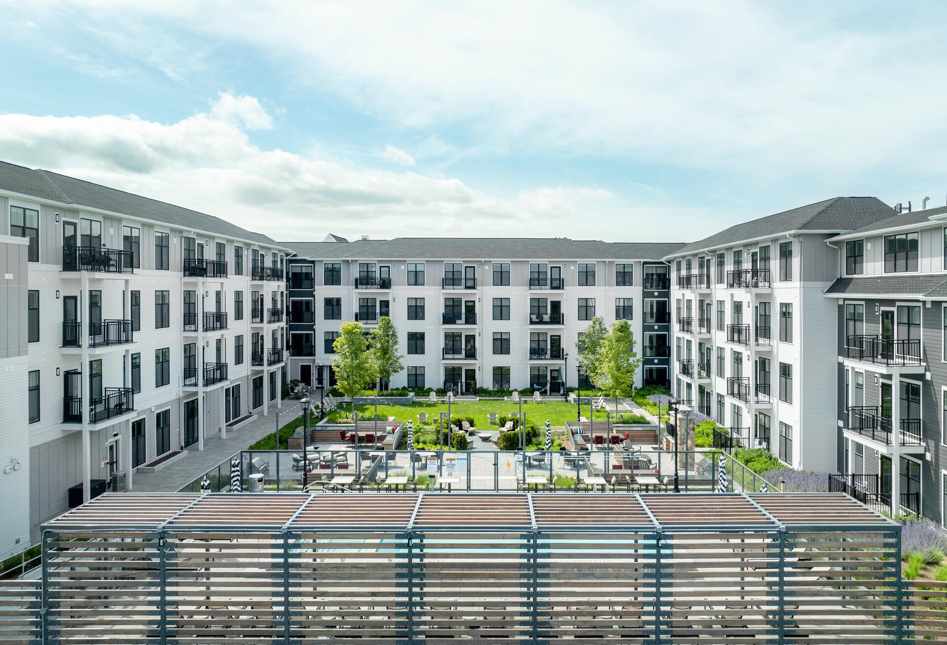 Meticulously crafted outdoor spaces with seating, grills, and lawns.