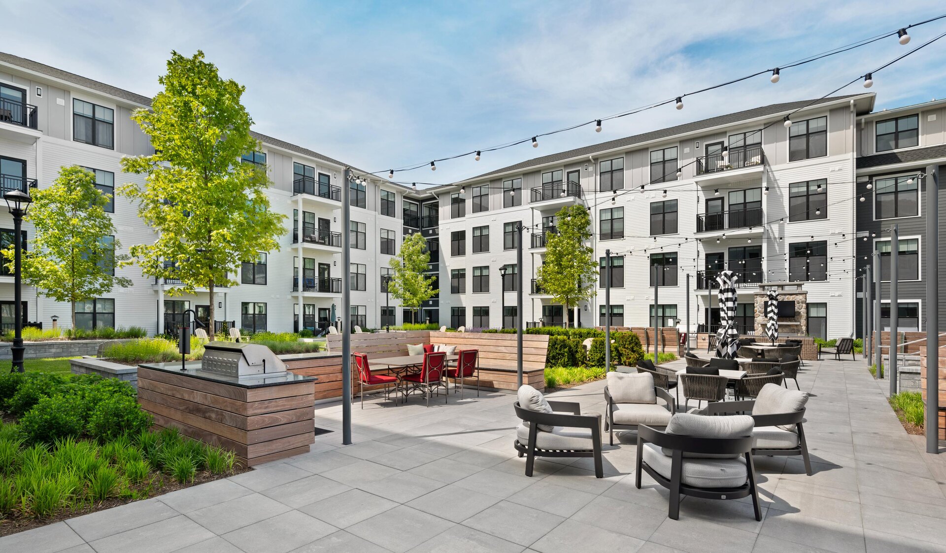 Inviting pool with fire pit and seating areas.